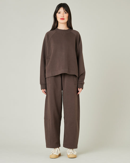 model wears chocolate jersey madi trousers