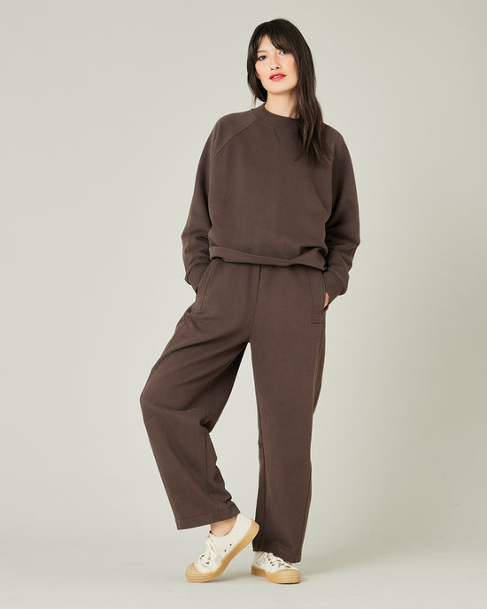 model wears chocolate jersey madi trousers