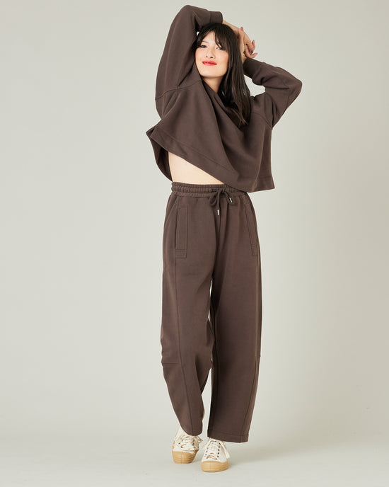 model wears chocolate jersey madi trousers