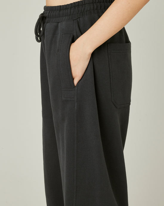 model wears slate jersey madi trousers