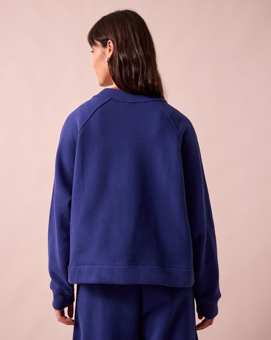 model wears noa french blue fleeceback jersey jumper