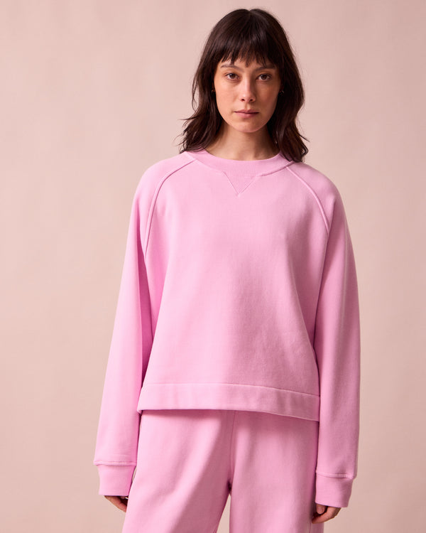 model wears noa orchid pink fleeceback jersey jumper