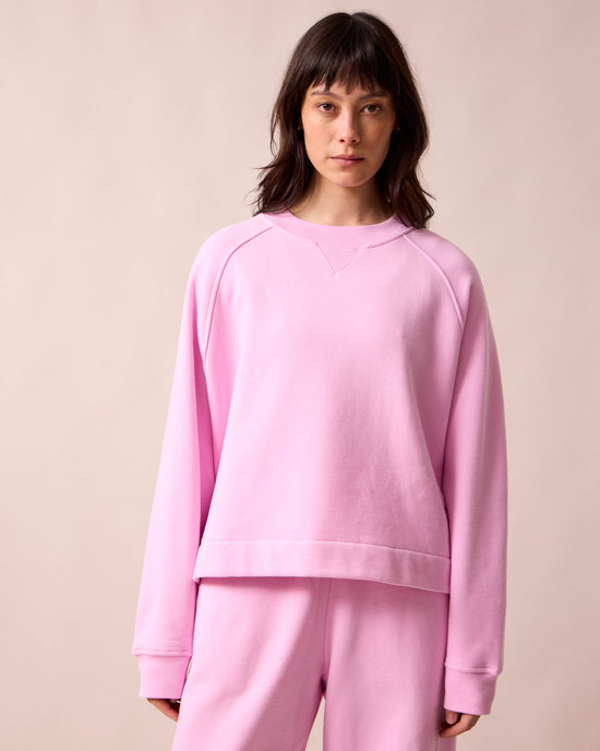 model wears noa orchid pink fleeceback jersey jumper