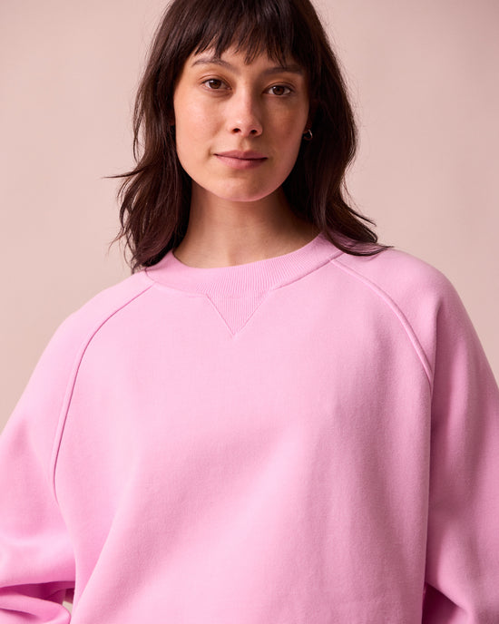 model wears noa orchid pink fleeceback jersey jumper