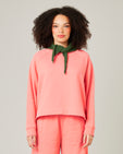 model wears shrimp pink noa jumper 