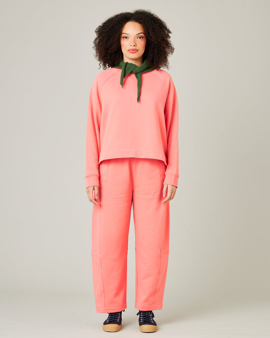 model wears shrimp pink madi trousers 