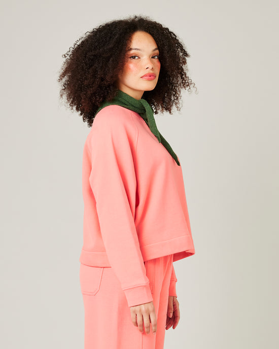 model wears shrimp pink noa jumper 