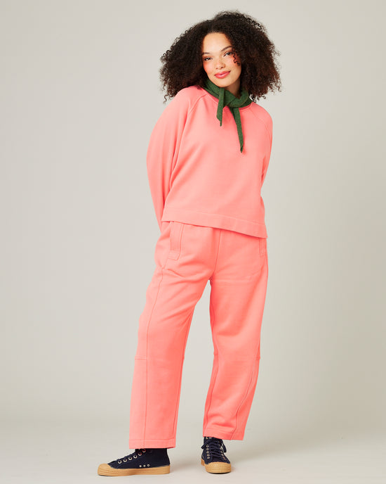 model wears shrimp pink noa jumper 