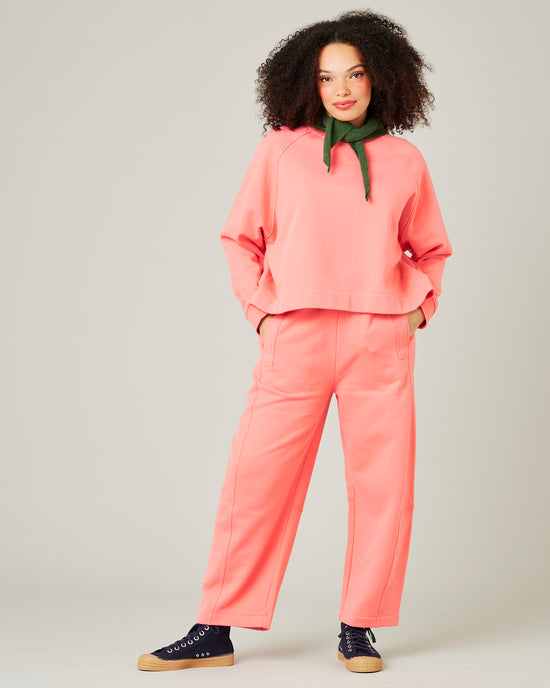 model wears shrimp pink noa jumper 