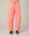 model wears shrimp pink madi trousers 