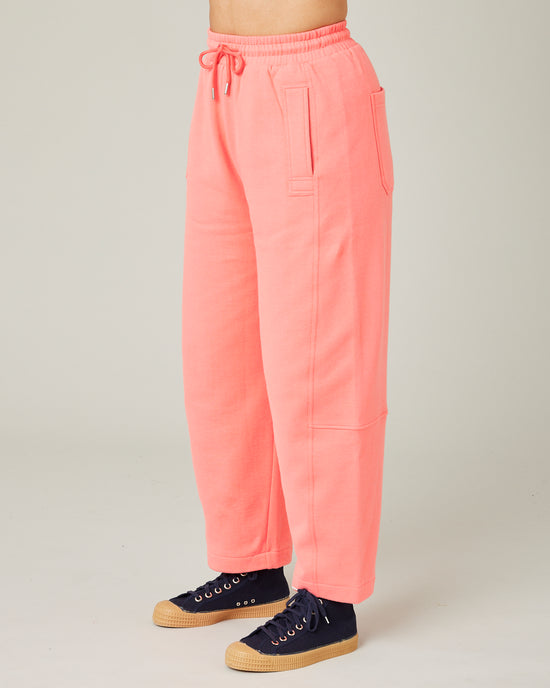 model wears shrimp pink madi trousers 