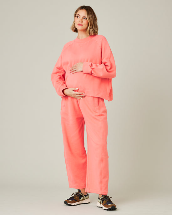 pregnant model wears shrimp pink noa jumper 