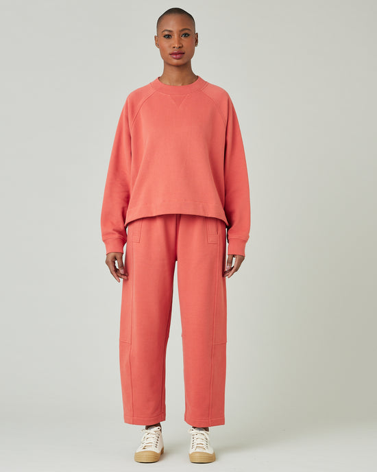 model wears terracotta jersey madi trousers