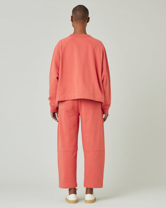 model wears terracotta jersey madi trousers