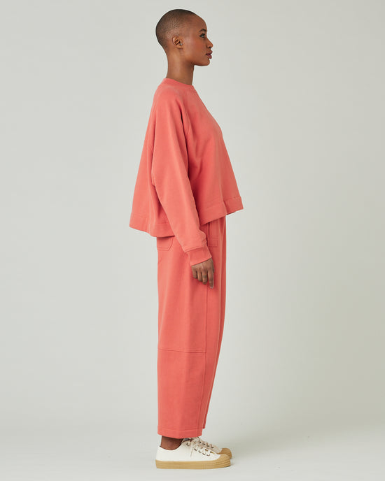 model wears terracotta jersey madi trousers