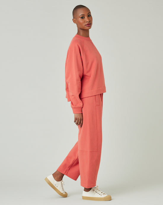 model wears terracotta jersey madi trousers