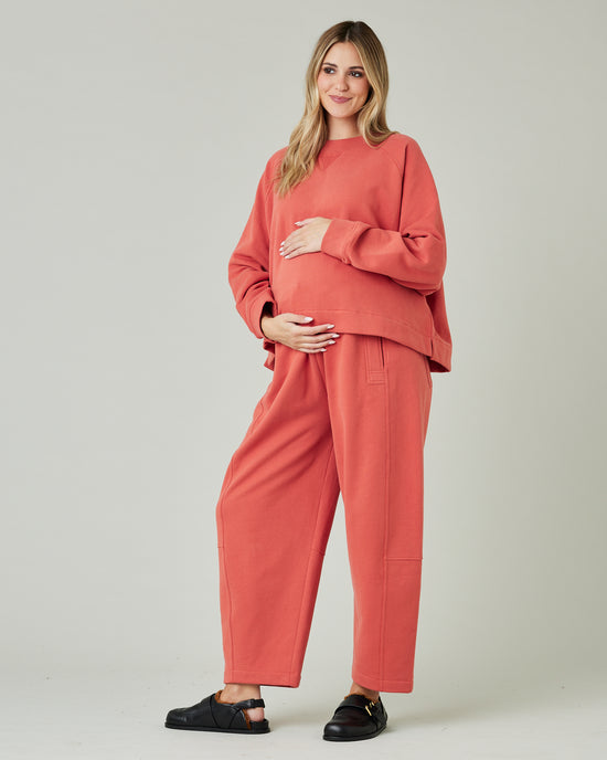 pregnant model wears terracotta jersey noa jumper