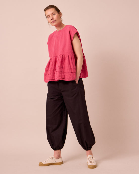 model wears nola raspberry stripe seersucker top