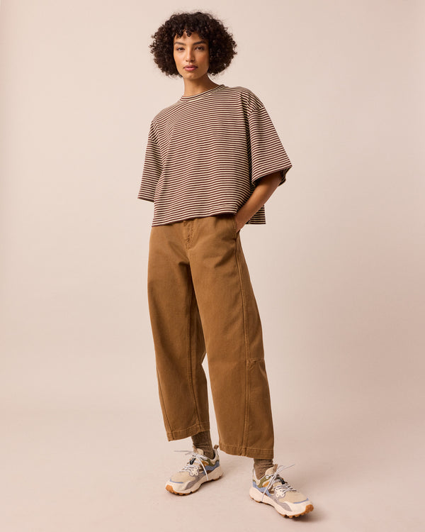 model wears nova brown and butter stripe jersey top