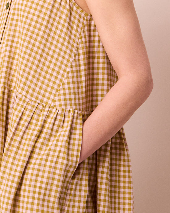 model wears olwen garden gingham cotton linen dress
