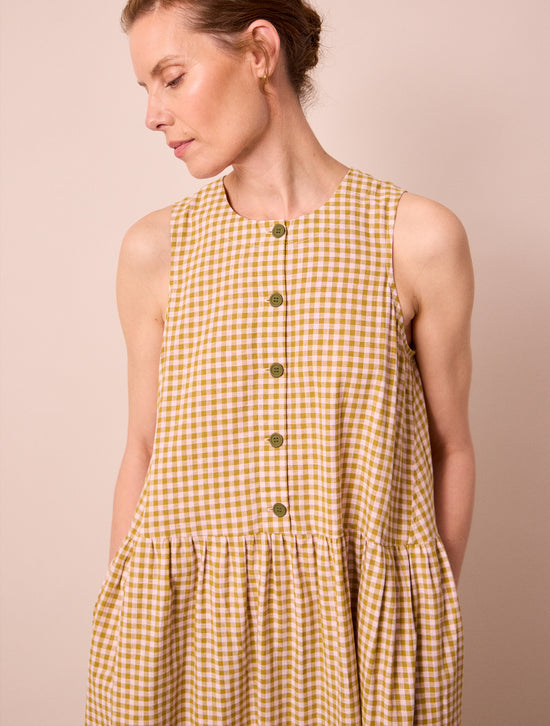 model wears olwen garden gingham cotton linen dress