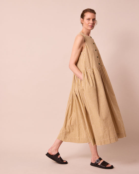 model wears olwen garden gingham cotton linen dress