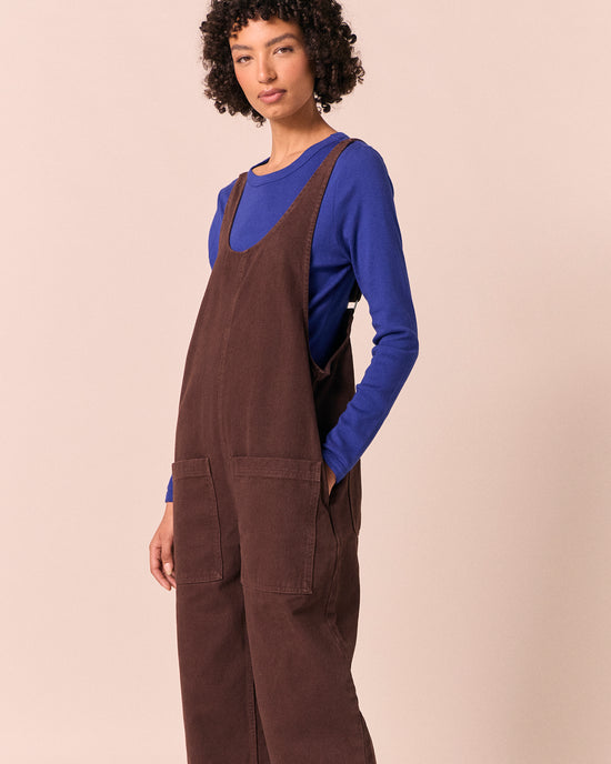 model wears ophelia cedar brown denim jumpsuit