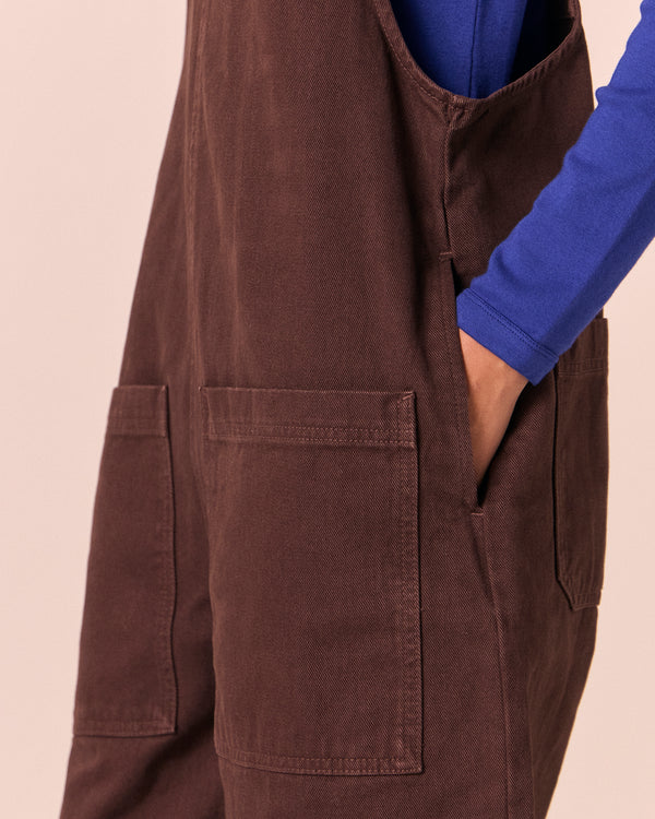 model wears ophelia cedar brown denim jumpsuit