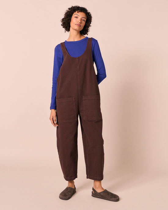 model wears ophelia cedar brown denim jumpsuit