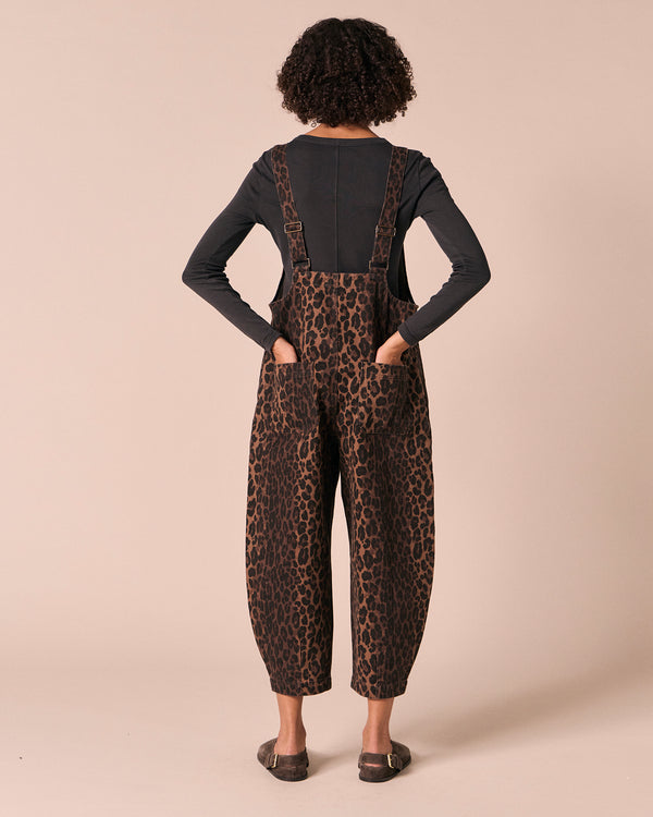 model wears ophelia dark leopard denim jumpsuit