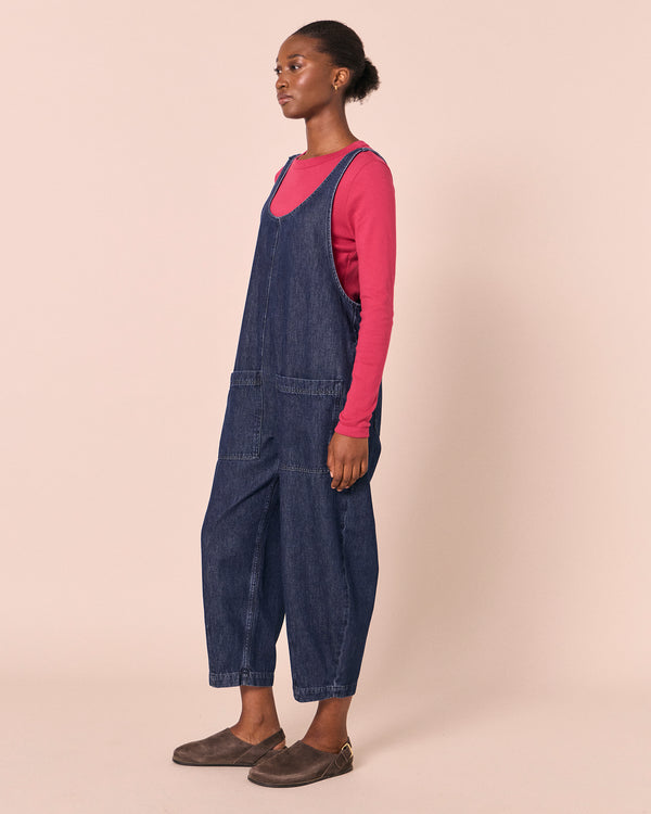 model wears ophelia dark wash denim jumpsuit