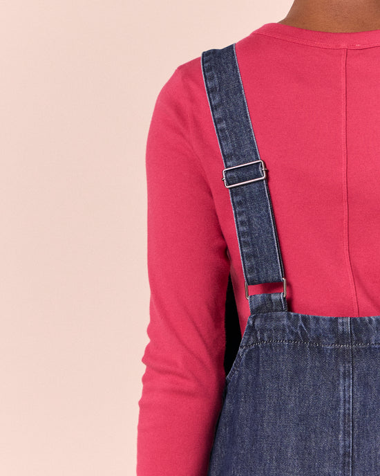 model wears ophelia dark wash denim jumpsuit