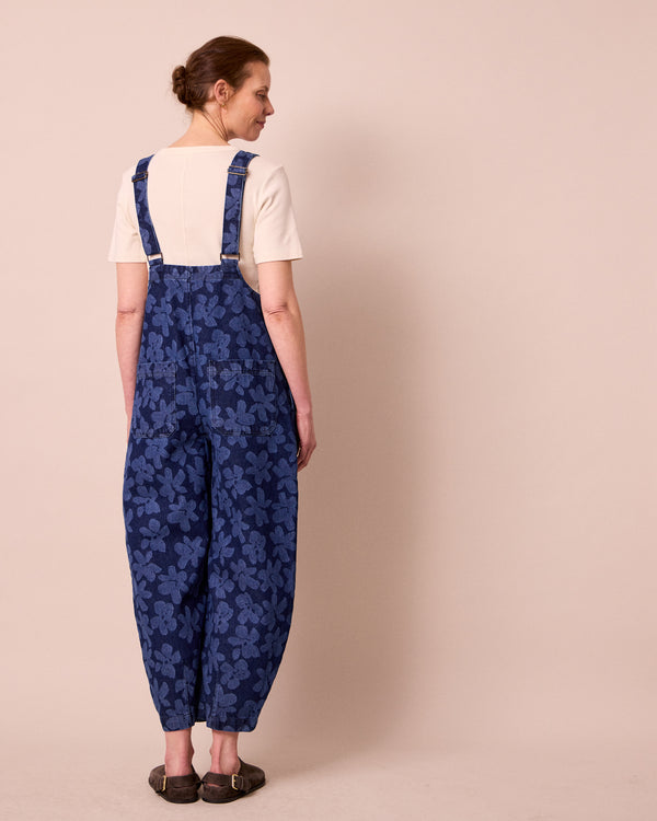 model wears ophelia pressed flower print denim jumpsuit