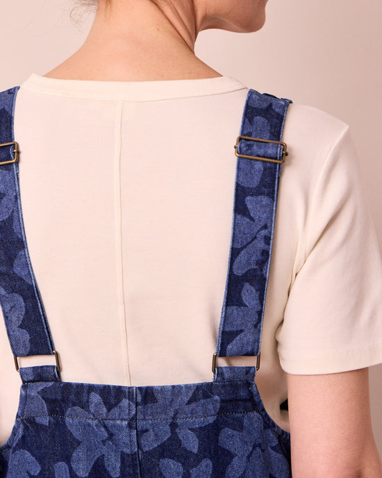 model wears ophelia pressed flower print denim jumpsuit