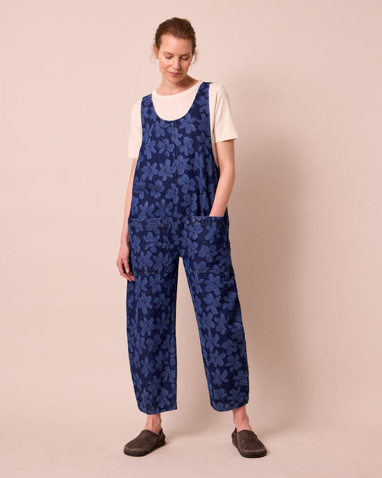 model wears ophelia pressed flower print denim jumpsuit