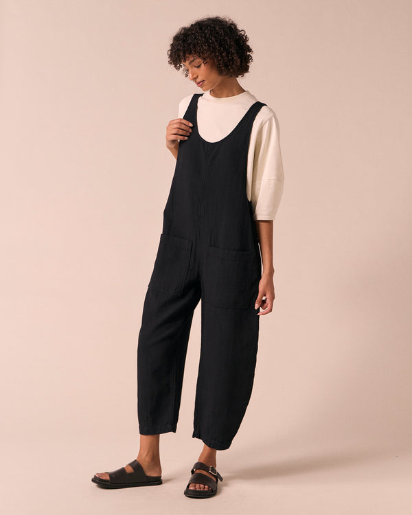 model wears ophelia black gauze jumpsuit