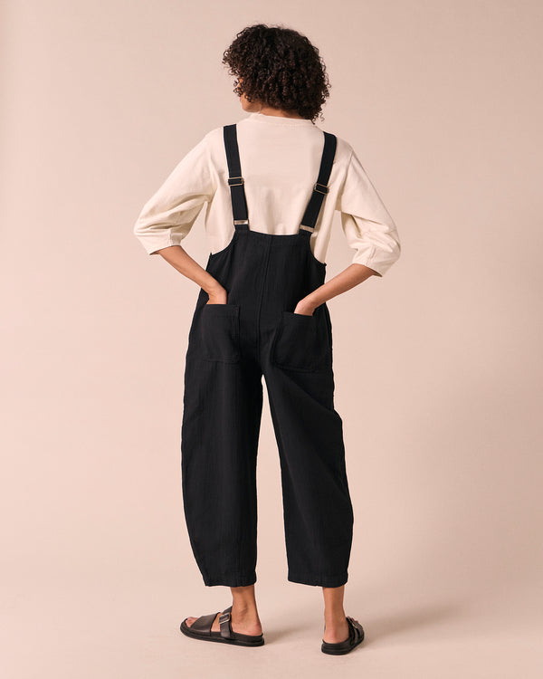 model wears ophelia black gauze jumpsuit