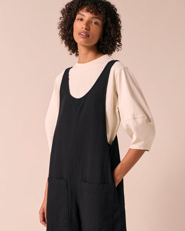 model wears ophelia black gauze jumpsuit