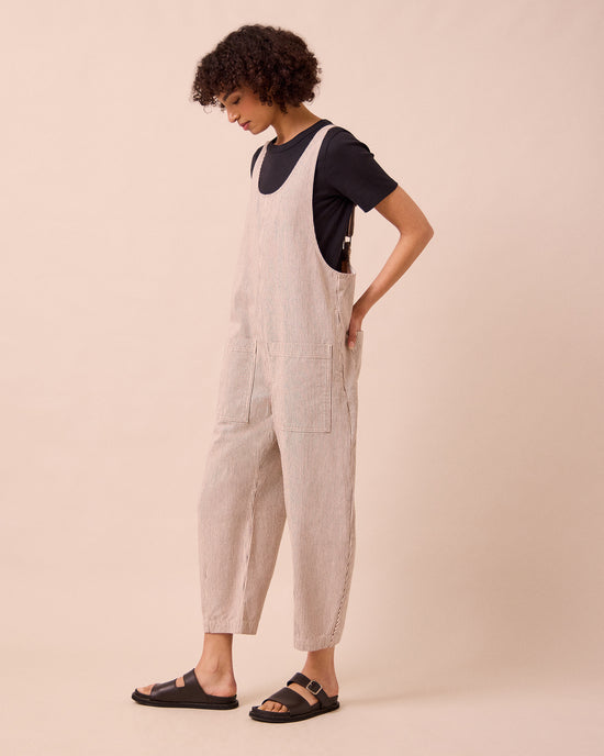 model wears the ophelia shell hickory stripe denim jumpsuit