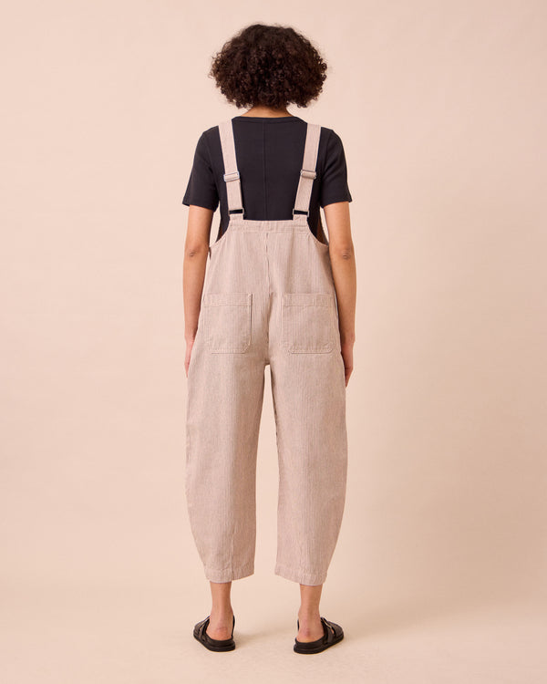 model wears the ophelia shell hickory stripe denim jumpsuit