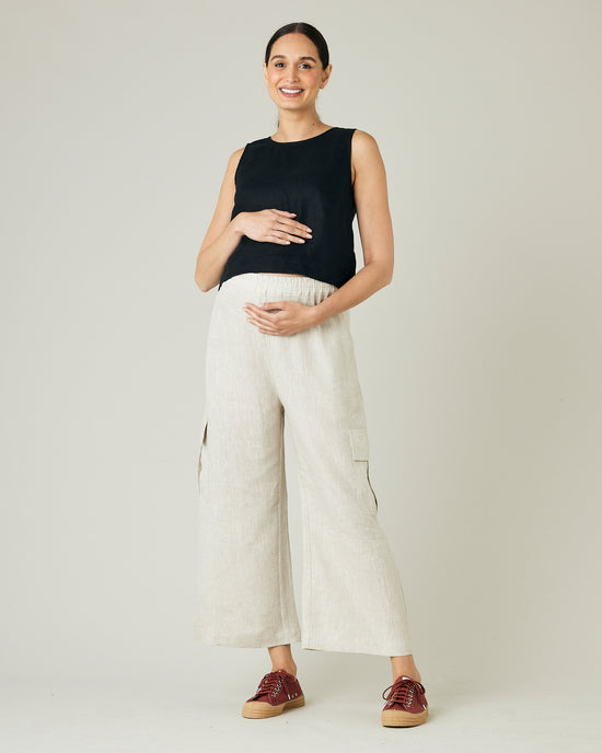 pregnant model wears natural linen orla trousers