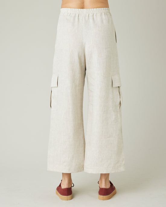 model wears natural linen orla trousers back