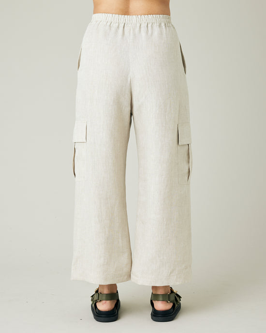 model wears natural linen orla trousers