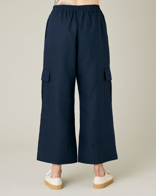 model wears navy linen orla trousers back