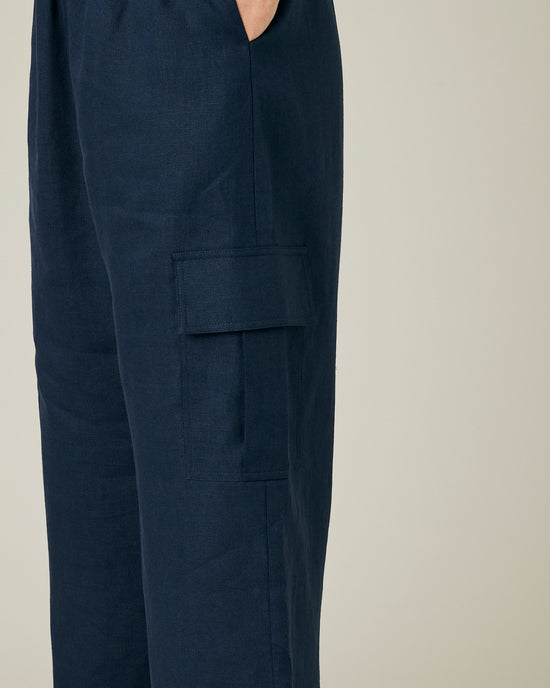 model wears navy linen orla trousers