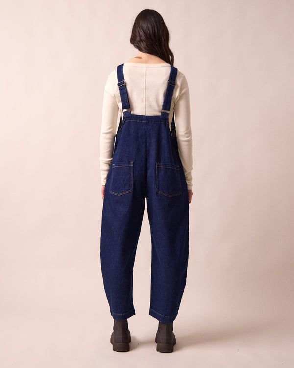 model wears ottie dark blue denim jumpsuit