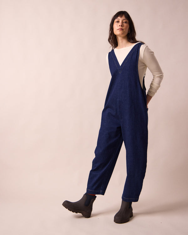 model wears ottie dark blue denim jumpsuit