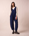model wears ottie dark blue denim jumpsuit