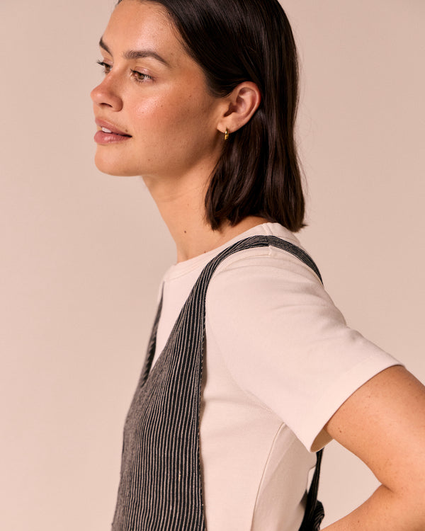 model wears ottie black and ecru pencil stripe linen jumpsuit