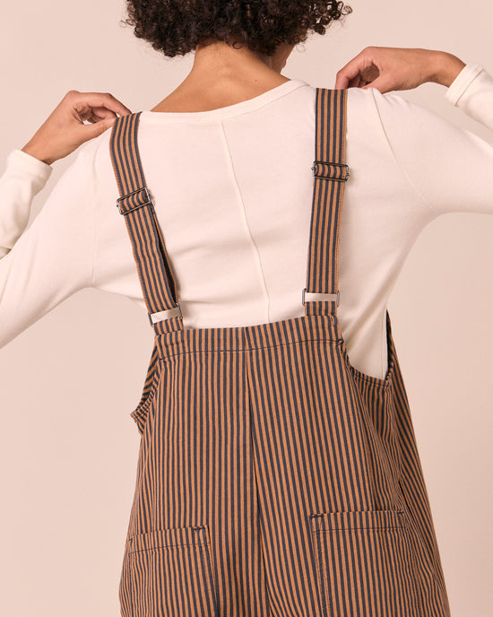 model wears ottie nutmeg pinstripe denim jumpsuit